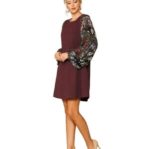 Gigio burgundy tee shirt dress with patchwork print, large flowy sleeves.